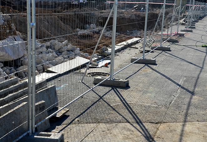 rows of temporary fence panels used at a concert venue to direct foot traffic and ensure safety